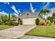 Single-story home with a two-car garage and well-maintained landscaping at 234 Fields Se Ter, Port Charlotte, FL 33952