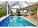 Private pool with water feature and screened enclosure at 234 Fields Se Ter, Port Charlotte, FL 33952