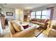 Bright living room features comfortable sofas and a coffee table, creating a welcoming atmosphere at 234 Fields Se Ter, Port Charlotte, FL 33952