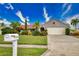 Single-story home with a two-car garage and nicely landscaped yard at 234 Fields Se Ter, Port Charlotte, FL 33952