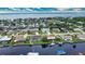 Aerial view of waterfront home with private pool and boat dock at 234 Fields Se Ter, Port Charlotte, FL 33952