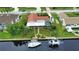 Property's aerial view highlighting canal-front location, boat dock, and pool at 234 Fields Se Ter, Port Charlotte, FL 33952