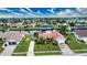 Attractive canal-front home with lush landscaping and two-car driveway at 234 Fields Se Ter, Port Charlotte, FL 33952