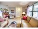 Spacious living room with hardwood floors, ample natural light, and comfortable seating at 234 Fields Se Ter, Port Charlotte, FL 33952