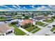 Canal-front home with lush landscaping, a large yard and two-car driveway at 234 Fields Se Ter, Port Charlotte, FL 33952