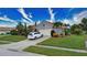 House with a two-car garage and manicured lawn, located on a quiet street at 234 Fields Se Ter, Port Charlotte, FL 33952