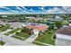 Single-story home on a canal with a large yard and two-car driveway at 234 Fields Se Ter, Port Charlotte, FL 33952