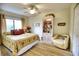 Bedroom with king-size bed and ceiling fan at 234 Fields Se Ter, Port Charlotte, FL 33952