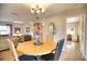Elegant dining room with round table and chairs, offering a view to the bedroom at 234 Fields Se Ter, Port Charlotte, FL 33952