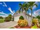 White garage door and nicely landscaped yard at 234 Fields Se Ter, Port Charlotte, FL 33952