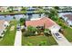 Aerial view of home with landscaped yard and two-car driveway at 234 Fields Se Ter, Port Charlotte, FL 33952