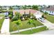 Aerial view showcasing home's curb appeal and landscaping at 234 Fields Se Ter, Port Charlotte, FL 33952