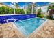 Enjoy this refreshing pool with a waterfall feature at 234 Fields Se Ter, Port Charlotte, FL 33952