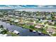 Aerial view showcasing waterfront property, pool, and boat lift at 234 Fields Se Ter, Port Charlotte, FL 33952