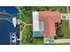 Directly above the home, showing the pool and boat dock at 234 Fields Se Ter, Port Charlotte, FL 33952