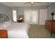 Large main bedroom with double doors leading to a patio and ensuite bath at 431 San Felix St, Punta Gorda, FL 33983