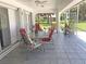 Spacious screened porch with seating area and view of backyard at 431 San Felix St, Punta Gorda, FL 33983