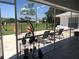 Relaxing screened patio with lounge chairs and view of backyard at 431 San Felix St, Punta Gorda, FL 33983