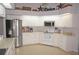 Spacious kitchen with white cabinets, stainless steel appliances, and ample counter space at 431 San Felix St, Punta Gorda, FL 33983