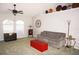 Living room features gray sofa, red trunk coffee table, and ceiling fan at 431 San Felix St, Punta Gorda, FL 33983