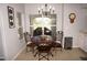Bright dining area with a round table and four chairs near sliding door at 431 San Felix St, Punta Gorda, FL 33983
