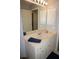 Double vanity bathroom with a large mirror and bright lighting at 431 San Felix St, Punta Gorda, FL 33983