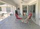 Screened porch features table and chairs, perfect for outdoor dining at 431 San Felix St, Punta Gorda, FL 33983