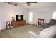 Spacious living room featuring hardwood floors, large windows, and a cozy seating area at 431 San Felix St, Punta Gorda, FL 33983