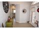 Home entryway with tiled floors, a coat rack, and green cabinet at 431 San Felix St, Punta Gorda, FL 33983