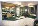 Bathroom boasts double vanity, green marble countertops, and ample storage at 431 San Felix St, Punta Gorda, FL 33983