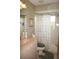 Bathroom with shower/tub combo, vanity, and floral shower curtain at 1307 Tidy Ln, Punta Gorda, FL 33983