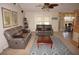Living room with gray leather furniture and a coffee table at 1307 Tidy Ln, Punta Gorda, FL 33983