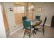 Bright breakfast nook features a window seat and wood table at 1307 Tidy Ln, Punta Gorda, FL 33983