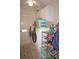 Laundry room with washer, dryer, and ample storage shelving at 1307 Tidy Ln, Punta Gorda, FL 33983