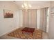 Spacious dining room with a lovely chandelier and window coverings at 1307 Tidy Ln, Punta Gorda, FL 33983