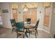 Charming breakfast nook with a wood table and four chairs at 1307 Tidy Ln, Punta Gorda, FL 33983