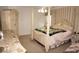 Main bedroom with post bed and large closet at 1307 Tidy Ln, Punta Gorda, FL 33983