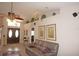 Elegant living room showcasing a comfortable sofa and access to the entryway at 1307 Tidy Ln, Punta Gorda, FL 33983