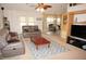Spacious living room featuring comfortable seating and a view into the kitchen at 1307 Tidy Ln, Punta Gorda, FL 33983