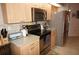 Updated kitchen featuring stainless steel appliances and ample cabinetry at 1307 Tidy Ln, Punta Gorda, FL 33983