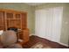 Home office features wood desk, built-in shelving and hardwood floors at 1307 Tidy Ln, Punta Gorda, FL 33983