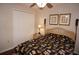 Bedroom with double bed, wicker furniture, and closet at 1307 Tidy Ln, Punta Gorda, FL 33983