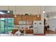 Kitchen features wood cabinets, microwave, and view to backyard at 8430 Acorn Blvd, Punta Gorda, FL 33982