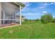 Screened patio with seating area, offering shade and protection from the elements at 8430 Acorn Blvd, Punta Gorda, FL 33982