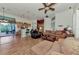 Open concept kitchen and living area with hardwood floors and island seating at 8430 Acorn Blvd, Punta Gorda, FL 33982