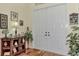 Bright entryway with double doors, wood floors, and decorative accents at 8430 Acorn Blvd, Punta Gorda, FL 33982