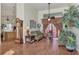 Comfortable living room with hardwood floors, a couch, and a view into the kitchen at 8430 Acorn Blvd, Punta Gorda, FL 33982