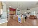 Kitchen with island, wood cabinets, and view to Gathering room at 8430 Acorn Blvd, Punta Gorda, FL 33982