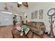 Living room with hardwood floors, a couch, and decorative wall art at 8430 Acorn Blvd, Punta Gorda, FL 33982