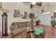 Living room with hardwood floors, a couch, and a view to the entryway at 8430 Acorn Blvd, Punta Gorda, FL 33982